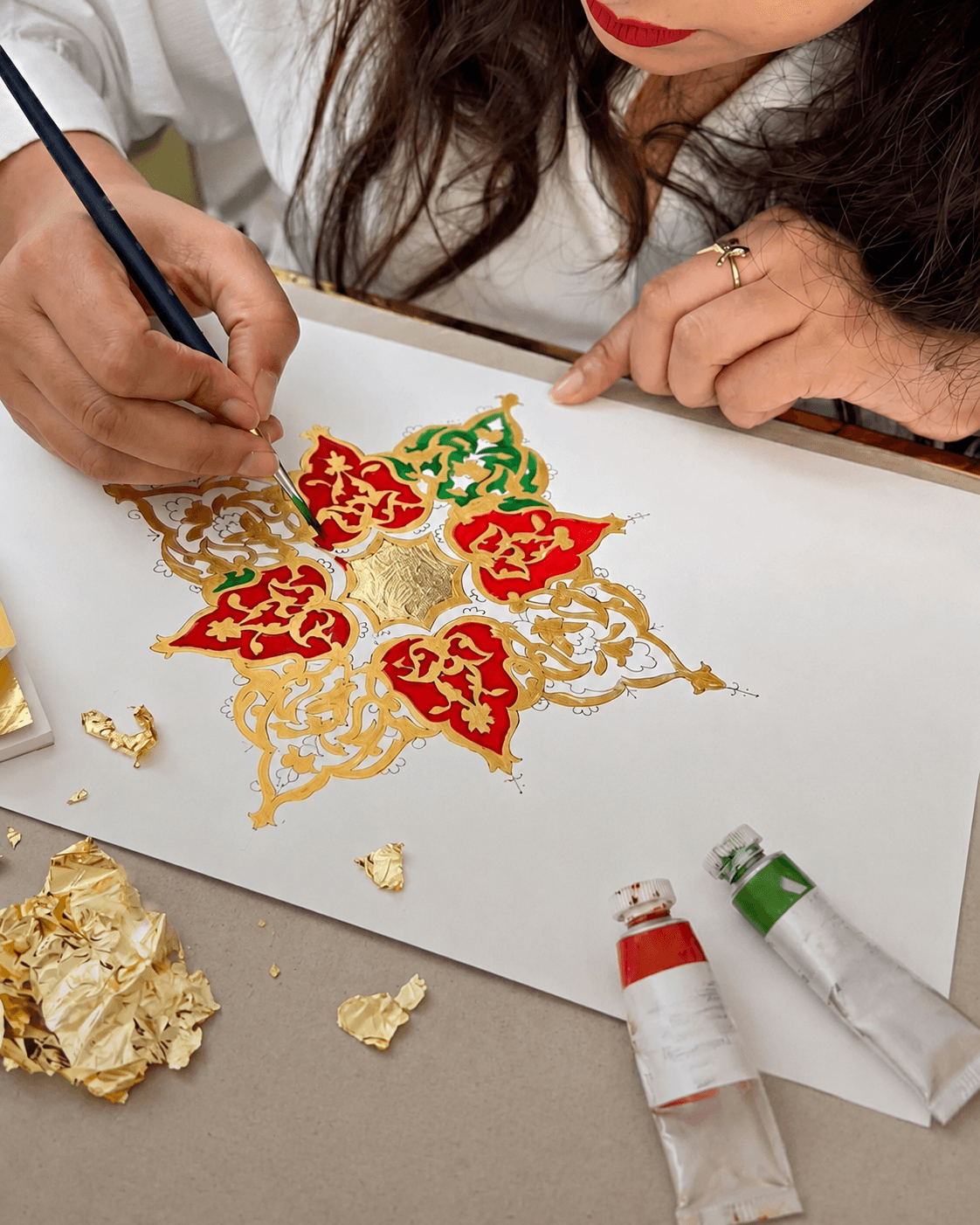 Rakhshinda Arshad working in her studio
